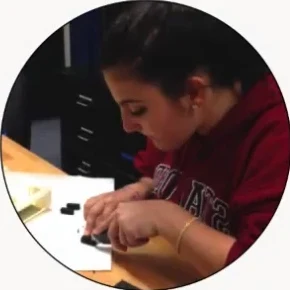 A student assembling an ISS experiment