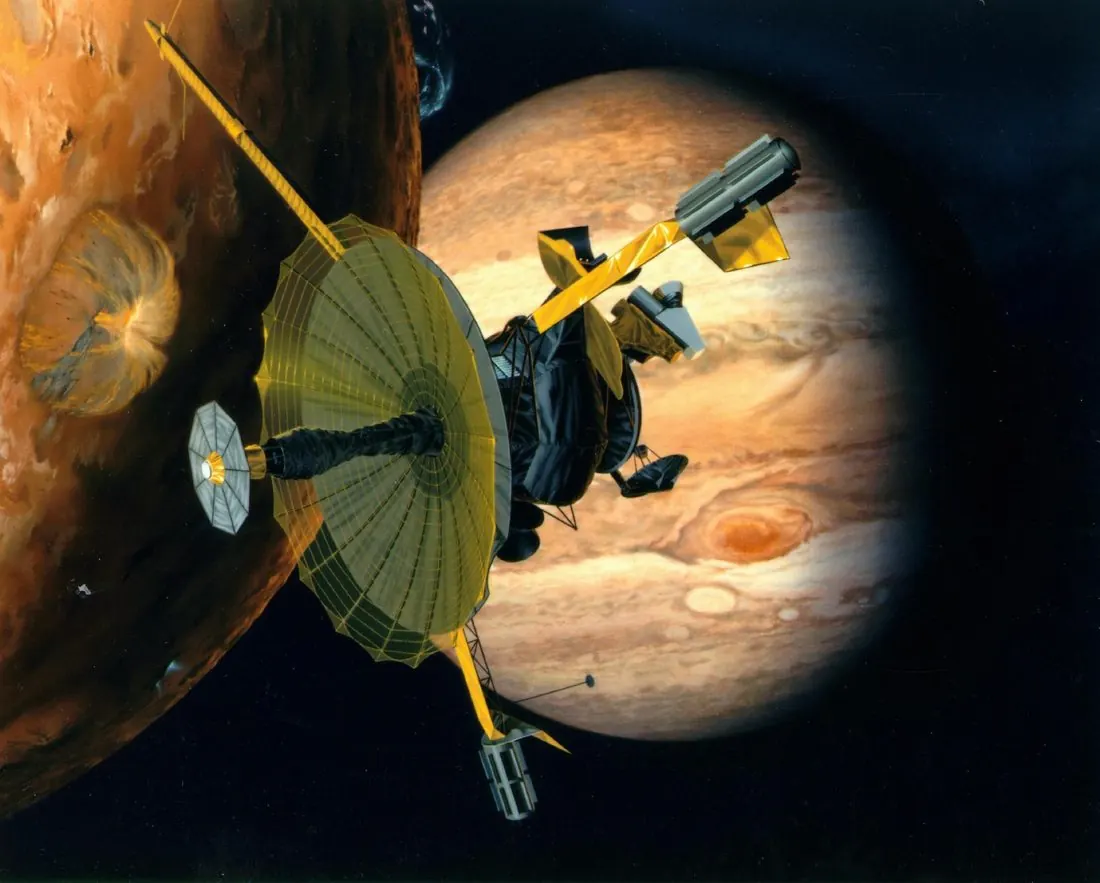 Artist's concept of the Galileo spacecraft passing Io with Jupiter behind